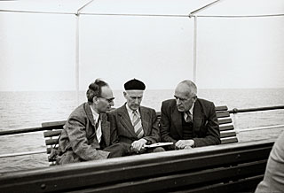 Kourganoff, Oort and Spencer at a Conference