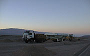 The convoy drives through the desert