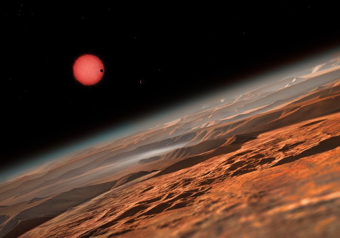 Impressão artística da estrela anã muito fria TRAPPIST-1 vista de muito perto de um dos seus planetas