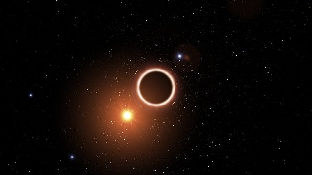 Impressão artística de estrela a passar por buraco negro supermassivo