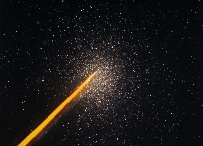 Laser guide star pointing to a globular cluster