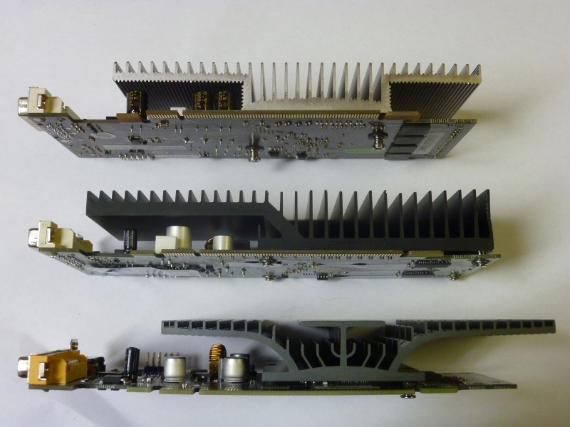 From top to bottom: the Point of View Nvidia GeForce 8400 GS, the pruned EVGA GF 210 and the ECS Silent Series NSG210C-512QR-H. (Brackets and VGA connectors removed)