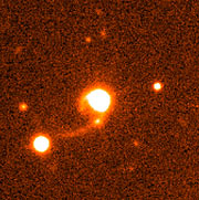 Quasar HE 1013-2136 with tidal tails
