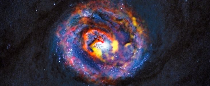 Galaxie NGC 1433 na složeném snímku z ALMA a HST