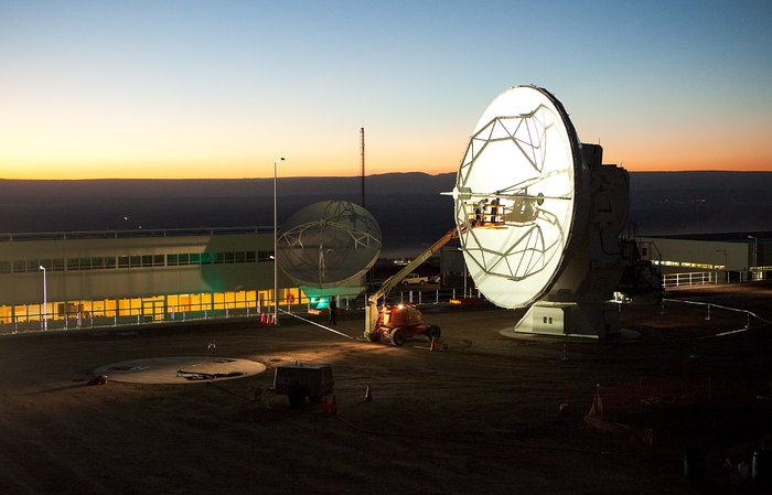 ALMA antennas and OSF at sunset