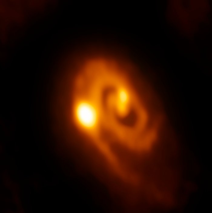 Young stellar system caught in the act of forming close multiples