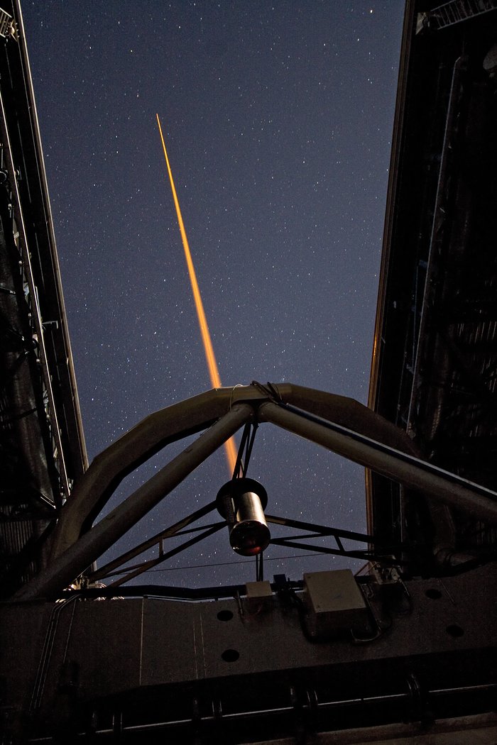 Laser beam creating an “artificial” star
