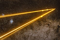 The VLT’s lasers passing through thin clouds